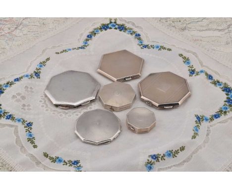 A collection of silver compacts, A collection of silver compacts, four of hexagonal shape, engine turned with central B inscr