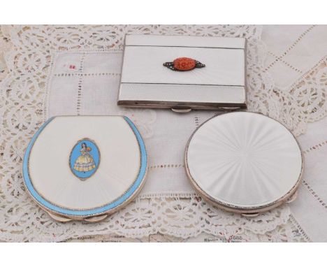 Three silver white guilloche enamel decorated compacts, Three silver white guilloche enamel decorated compacts, circular form