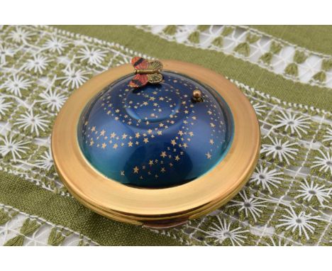 A 1950s Kigu Flying Saucer Musical compact, A 1950s Kigu Flying Saucer Musical compact, brass body with domed enamel starry s