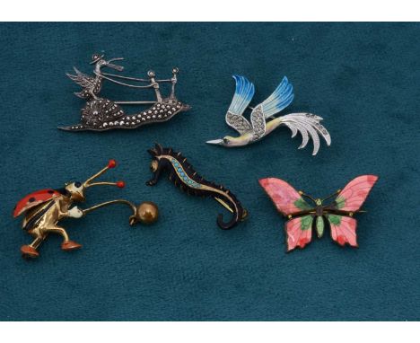 A novelty gilt metal and enamel brooch, of a ladybird fishing, 3.5cm x 2cm, a seahorse silver gilt brooch, 3.8cm x 1.4cm, a n