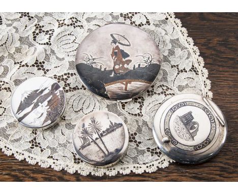 A Japanese silver compact, A Japanese silver compact, having Mt Fuji and buildings in copper to top, script and impressed Sil