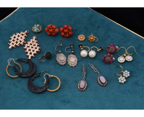 A collection of eleven pairs of antique earrings, in various states of repair including a pair of opal gold clusters, coral c
