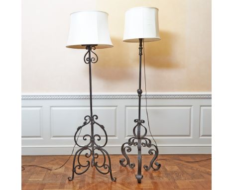 Raised on three scrolled legs; Together with a Baroque Style Patinated Bronze Floor Lamp, raised on a scrolled tripod base.He