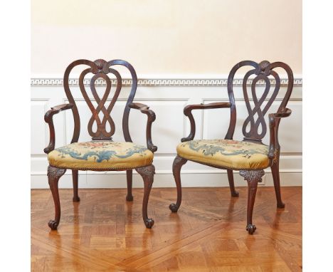 Each pierced double-arched interlaced waisted backrest centered by a shell above a multicolored floral tapestry-upholstered b