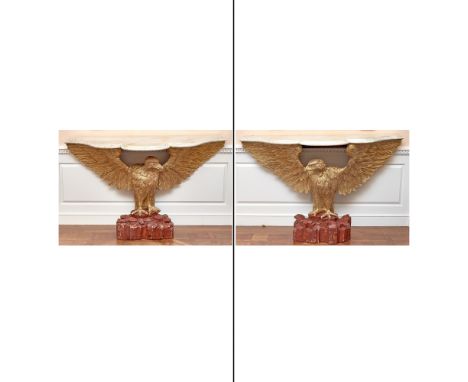 Each lobed serpentine white marble top on a standing outspread winged eagle support with red-painted rocky perch.Height 38 in