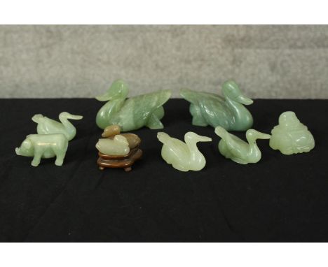 A collection of jade. Eight animals and one buddha. A mix of swans, ducks and pigs. The largest measures H.5 x W.9cm. 