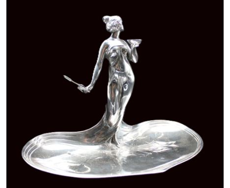 A WMF Art Nouveau silvered table card tray, early 20th century, having central standing lady holding bowl and bulrush flower,