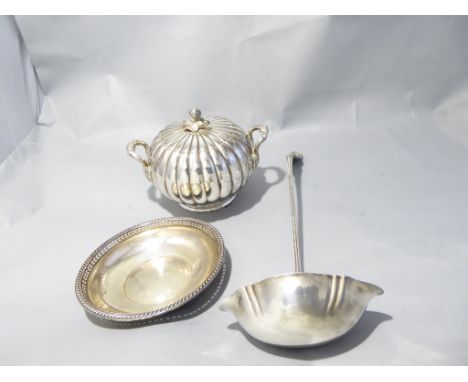 A sterling silver ladle, two bon bon dishes and a plated scalloped twin handled pot