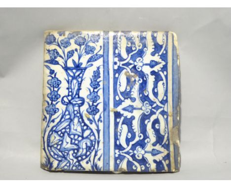 A C16th-C17th tile in Ottoman Iznik style manufactured in Damascus, Syria. Decorated with a 'marble finish' vase and scrollin