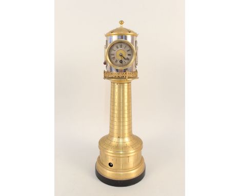 A brass cased lighthouse clock with rear facing barometer, two thermometers with rotating head action