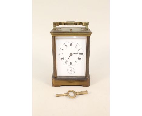 A brass cased alarm carriage clock