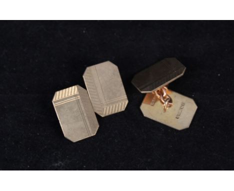 A pair of 9ct gold cufflinks with engine turned decoration