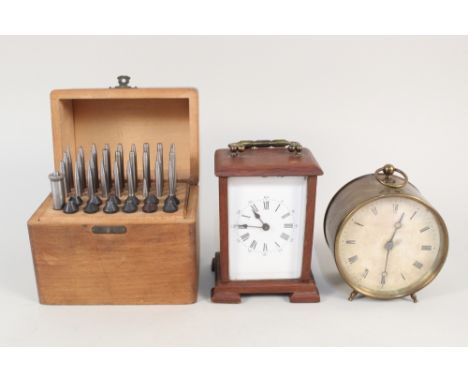 A wooden carriage clock, circular brass clock plus cased engineers tools