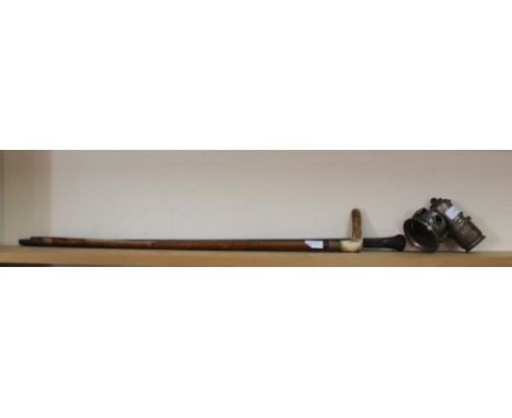 Two walking canes plus a cycle carbide lamp