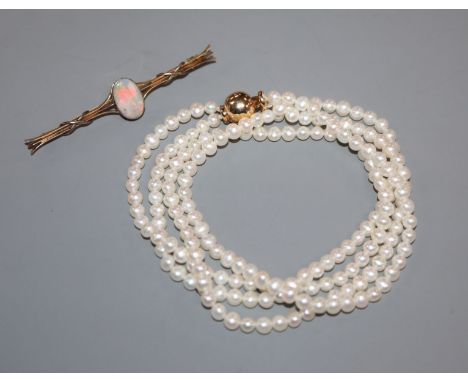 A 15ct and opal bar brooch and a two-row uniform pearl necklace with 14k ball clasp.