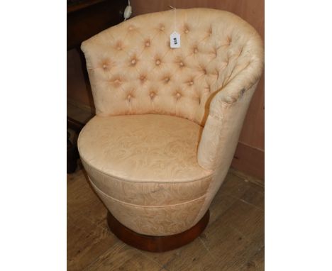 An Art Deco style button back upholstered tub chair