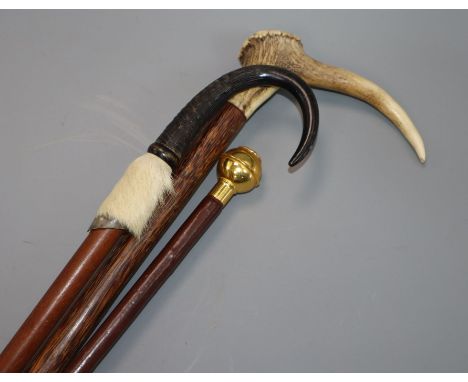 Two horn / antler canes and a swagger stick