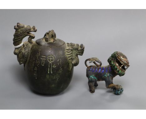 A Chinese bronze 'dragon' water dropper archaic seal mark, probably 17th/19th century and a Chinese model of a buddhist lion,