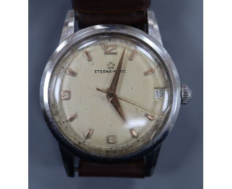 A gentleman's steel Eterna-Matic manual wind wrist watch, with date aperture, on brown leather strap.