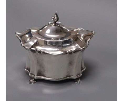 An Edwardian silver shaped oval tea caddy, Chester, 1906, height 10.5cm.