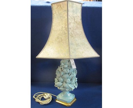 20th Century pottery table lamp, overall with blue relief fruit and foliate base, with shade.(B.P. 24% incl. VAT)