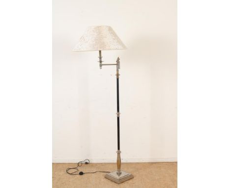 Part stainless steel floor lamp with articulated arm, h. 175 cm.Deels rvs staande schemerlamp met knikarm, h. 175 cm.