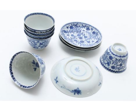 A set of 6 porcelain cups and 4 saucers, decorated with flowers  and insects, marked: Kangxi, in double circle, China (2x  ha