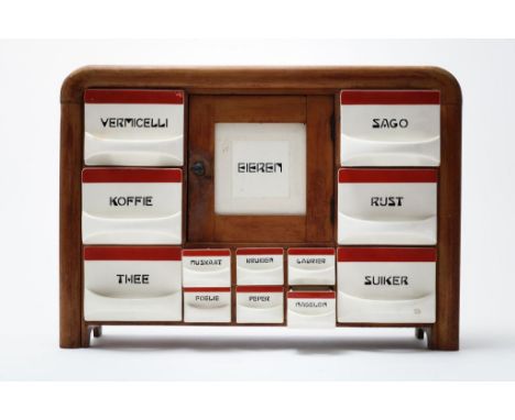 Spice rack, Societe Ceramique, in wooden fram with 12 pottery  drawers and an egg door, ca. 1930 (sugar drawer chip), h. 44, 