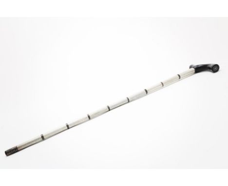 A bone and horn walking stick with hardwood handle, inlaid with  silver, l. 87 cm. (handle piece missing)Benen en hoornen wan
