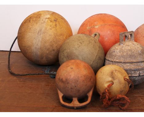 An assortment of vintage biconical marine buoys (7 items)