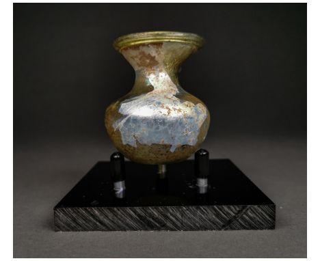 Ca.200-400 AD. A light green glass squat bulbous body jar, short neck, flared wide mouth. Intact. A nice example.beautiful ir