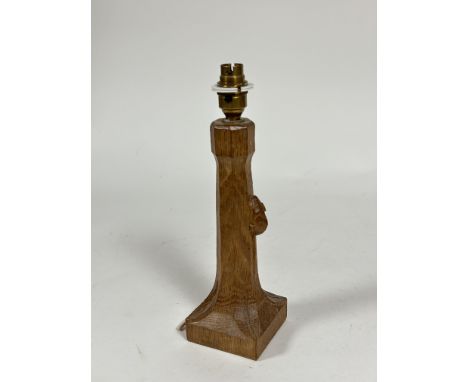 Workshop of Robert Mouseman Thompson, an oak table lamp, on a square base, with carved mouse signature. 25.5cm