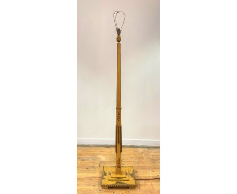 A parcel gilt and lacquered chinoiserie floor lamp, circa 1920, the square tapered and chamfered stem on a stepped square bas