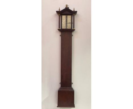 A Regency rosewood cased stick barometer, the moulded arched top with three brass urn finals over turned pilasters, straight 