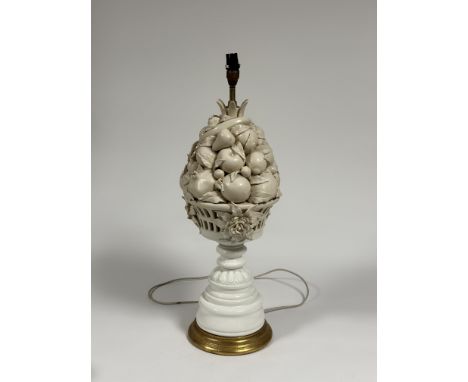 A large Casa Pupo white-glazed table lamp, c. 1970, modelled as a tall basket of fruit, on a giltwood base. Height excluding 