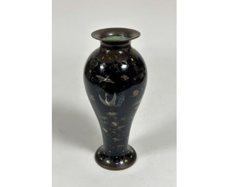 A Japanese cloisonne enamel vase, Meiji period, c. 1900, of slender baluster shape, decorated in polychrome enamels with exot