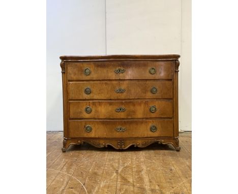 A Continental walnut commode of serpentine outline, 19th century, the plain top over four long drawers flanked by quarter pil
