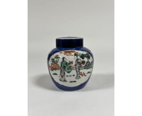 A Chinese famille rose porcelain jar and cover, painted with figural and floral cartouches against a powdered blue ground, un