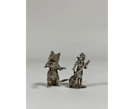 Two silver miniature models: a cat wielding a conductor's baton, Hamilton &amp; Inches, London 2007; and a winged putto playi