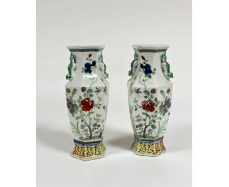 A pair of Chinese famille rose porcelain baluster vases, of faceted baluster form, with chilong handles, painted with insects