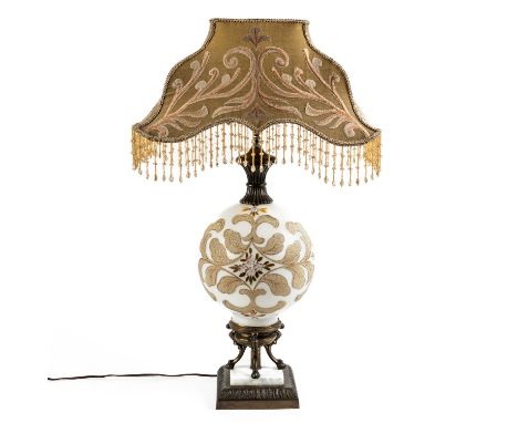 AN IVORY GROUND METAL AND CERAMIC GLOBULAR TABLE LAMPWith glass bead and floral embroidered shade, 80cm high incl. shade