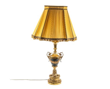 A GILT-METAL GRECIAN URN TABLE LAMPWith pleated silk shade, 108cm high incl. shade