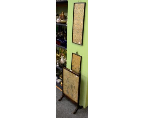 A Chinese rosewood fire screen inset with embroidered panels and two further frame Chinese embroidered panels 