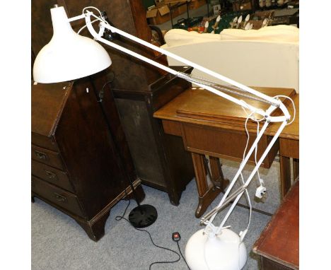 An oversized anglepoise floor lamp and a similar lamp 