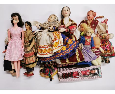 A quantity of vintage collector's dolls.