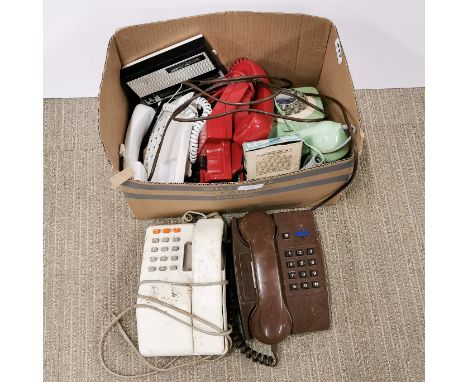 A group of vintage telephones.