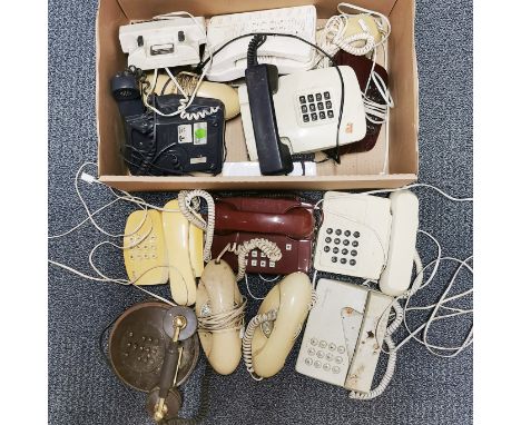A group of vintage telephones.