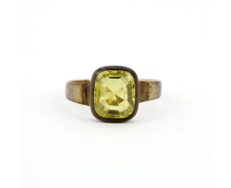 A rose metal ring set with a large emerald cut citrine, (Q).