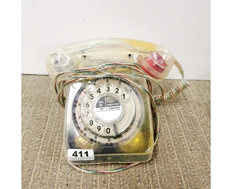 An unusual clear cased vintage telephone.