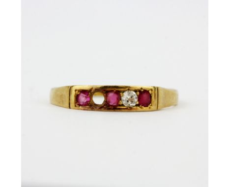 An 18ct yellow gold diamond and ruby set ring, (N). One diamond missing and worn hallmark. Approx 1.8g.